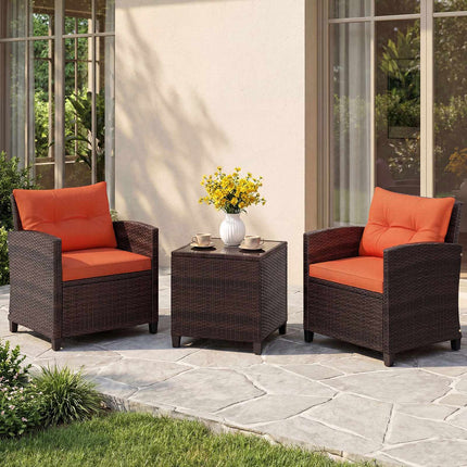 3-teiliges Rattan-Loungeset mit orangefarbenen Kissen