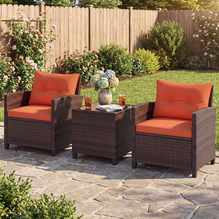 3-teiliges Rattan-Loungeset mit orangefarbenen Kissen