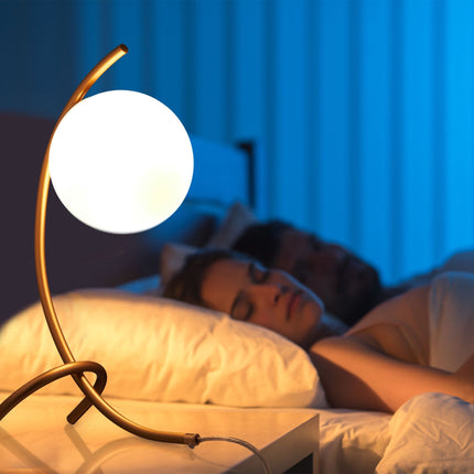 Arched table lamp with globe shape