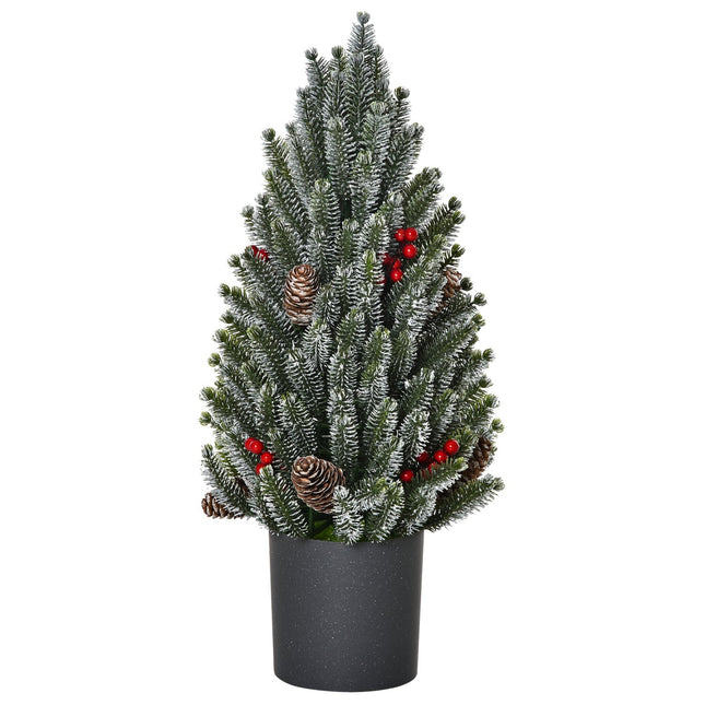 Schneebedeckter Tischweihnachtsbaum mit Beeren und Tannenzapfen
