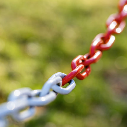 Barrier post made of plastic with chain