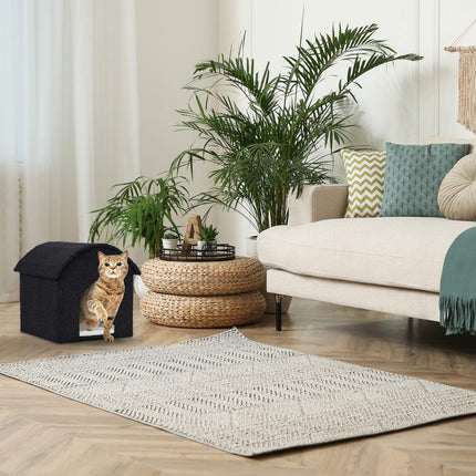 Black cat hide with scratching surface