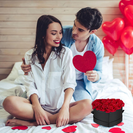 Black heart-shaped rose box with 18 roses