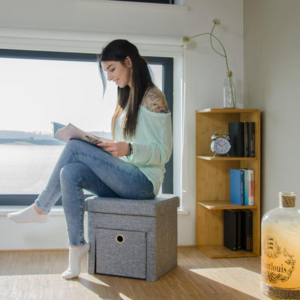 Folding stool in linen with compartment