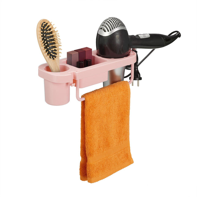 Hair dryer holder for the wall