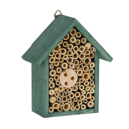 Insect hotel for wild bees in green