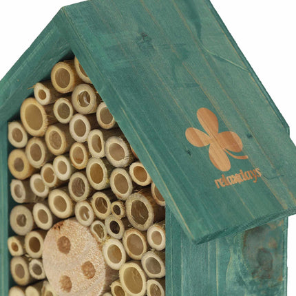 Insect hotel for wild bees in green
