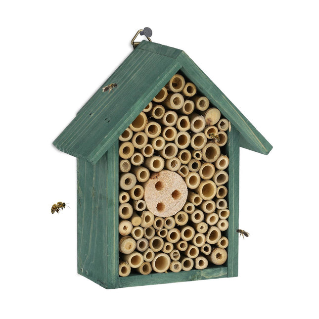 Insect hotel for wild bees in green