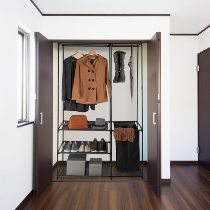 Open wardrobe with laundry basket