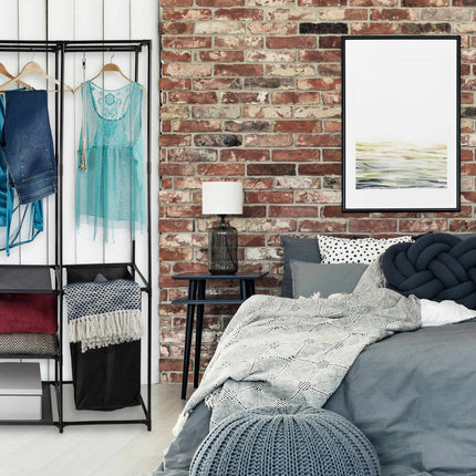 Open wardrobe with laundry basket