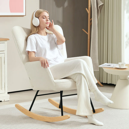 White padded rocking chair with armrests, wooden base