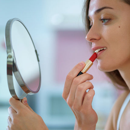 Standing cosmetic mirror with magnification
