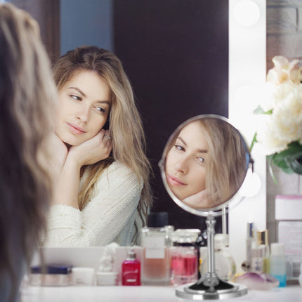 Standing cosmetic mirror with magnification