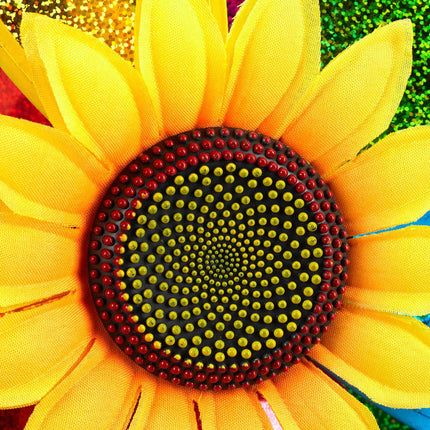 Vom Wind zerzauste Blume