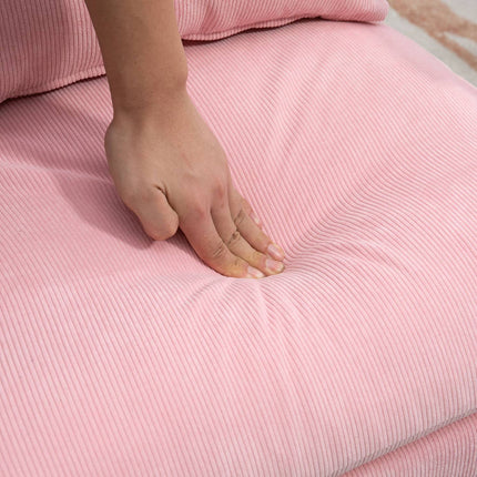 Wing chair with stool, tilting backrest, pink upholstery